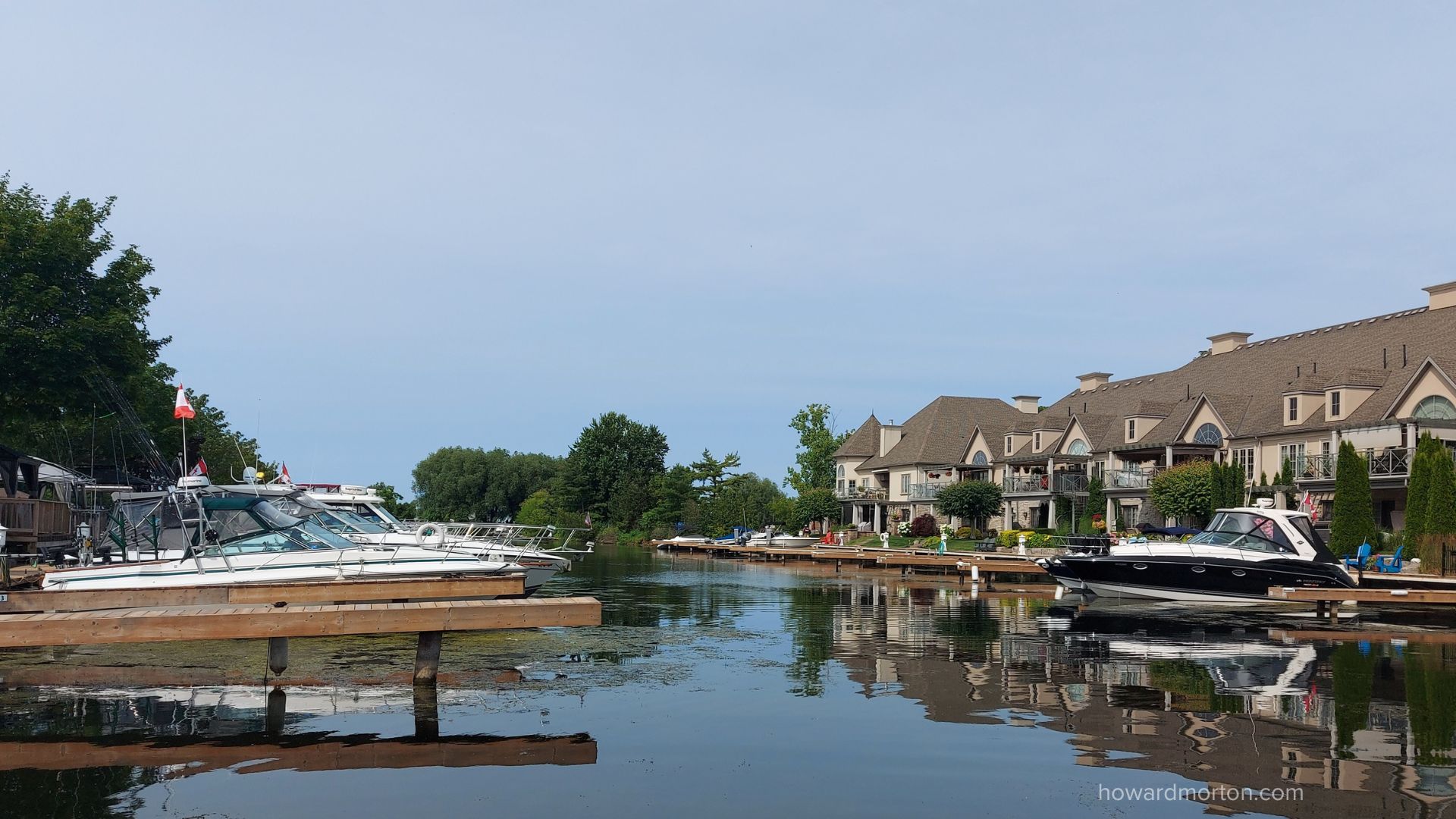 Grimsby marina townhouses with boats docked behind
